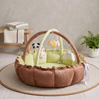 Brown and green Woodland Chestnut play gym nest with hanging animal toys