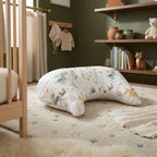 U-shaped baby tummy time pillow in a calm nursery