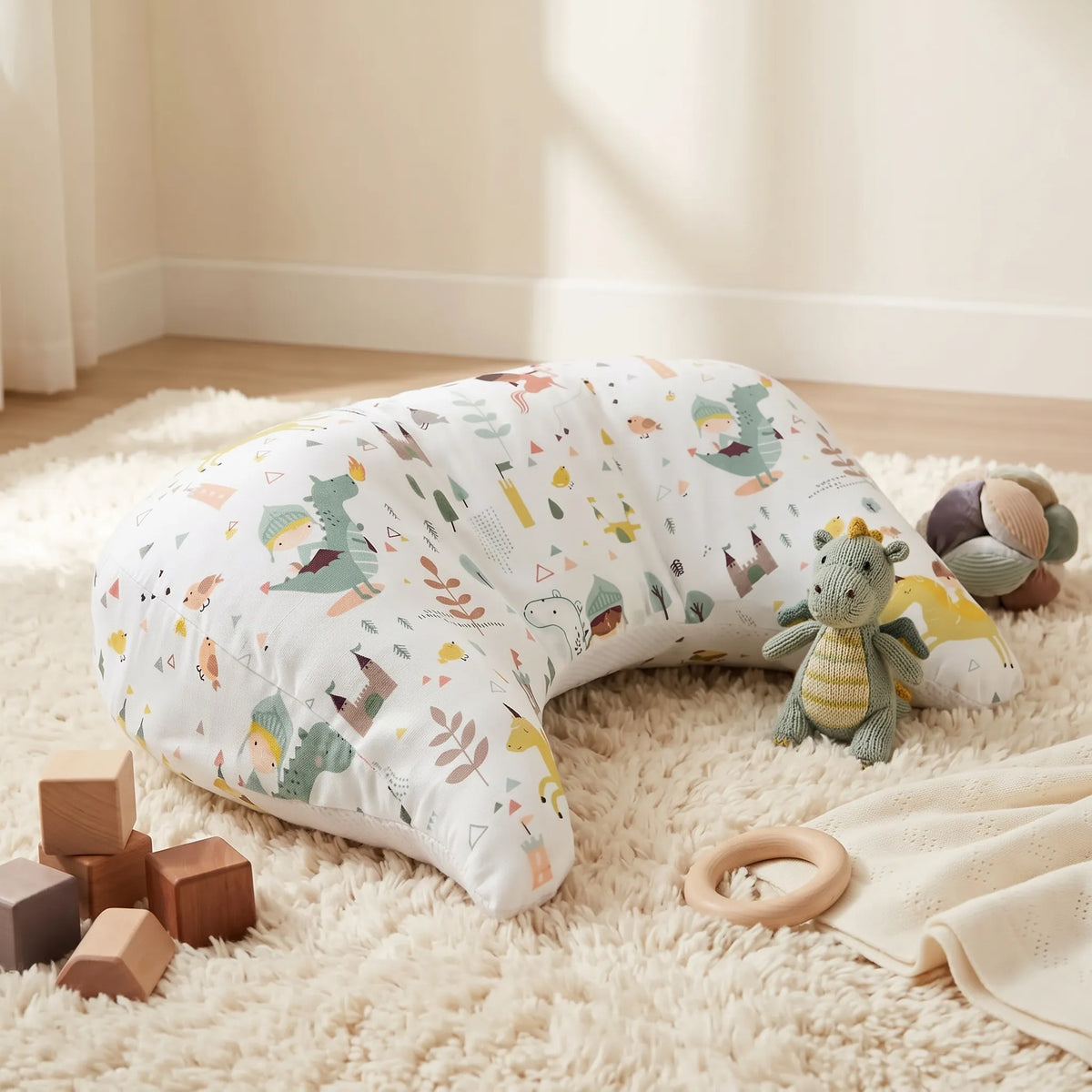 Green Dinosaur tummy time pillow with wooden toys
