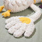 Close-up of the soft dotted fleece patting hand with yellow embroidered detail