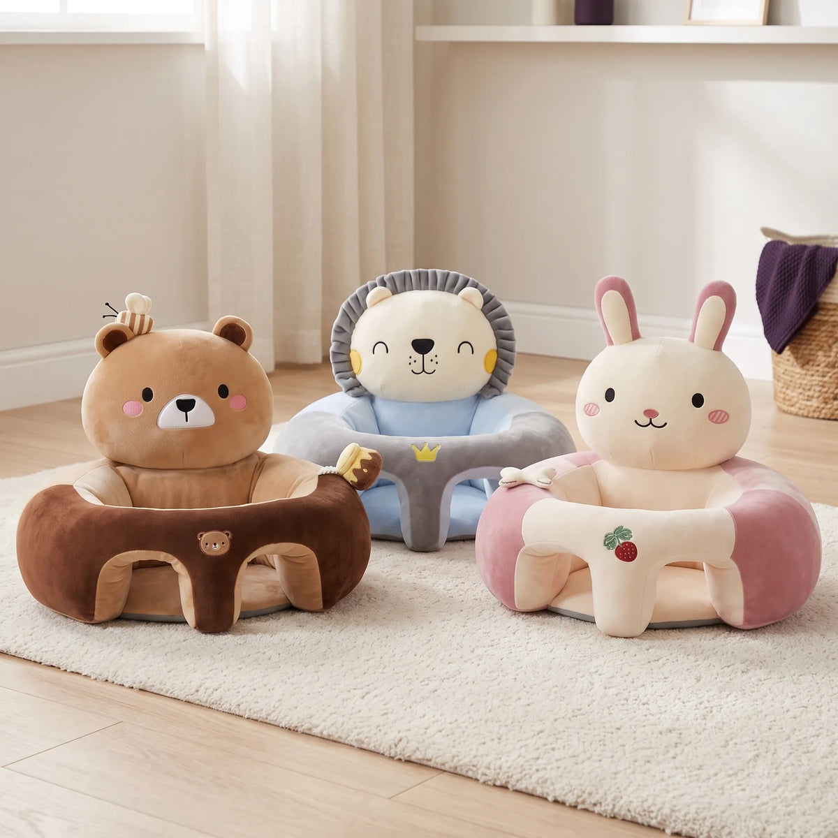 Three baby support seats in bear, lion and bunny designs on a nursery floor